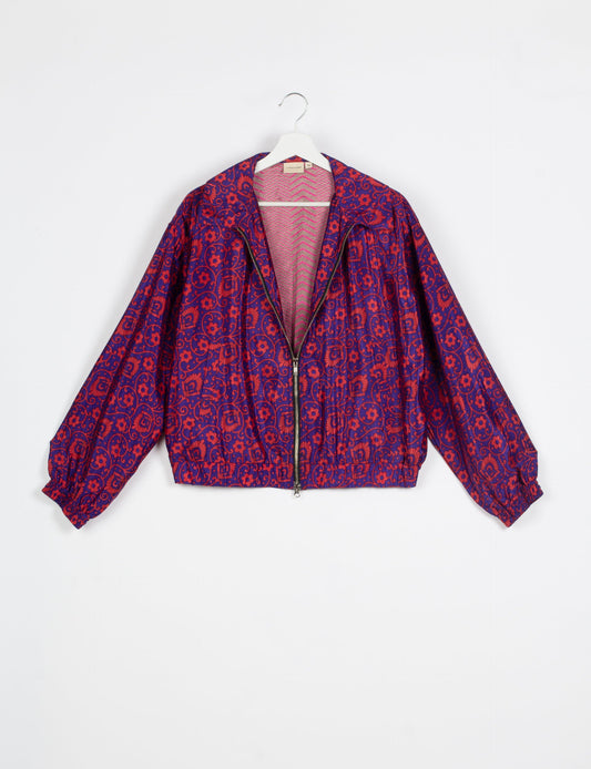 Stylish BOMBER JACKET, an upcycled clothing masterpiece with a cute cropped shape, elasticated details, and detachable metallic zipper. Contrast sari print lining adds a unique touch. Explore sustainable and eco-friendly fashion.