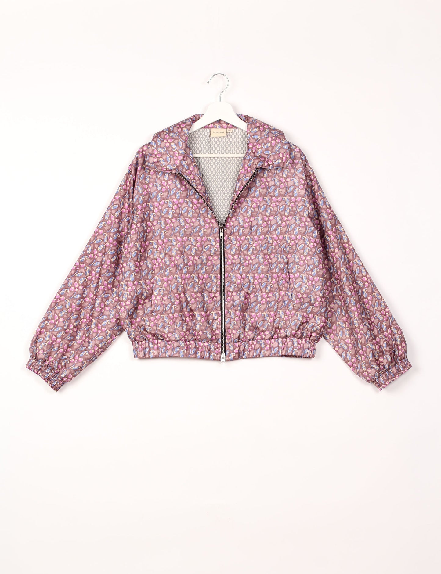 Stylish BOMBER JACKET, an upcycled clothing masterpiece with a cute cropped shape, elasticated details, and detachable metallic zipper. Contrast sari print lining adds a unique touch. Explore sustainable and eco-friendly fashion.