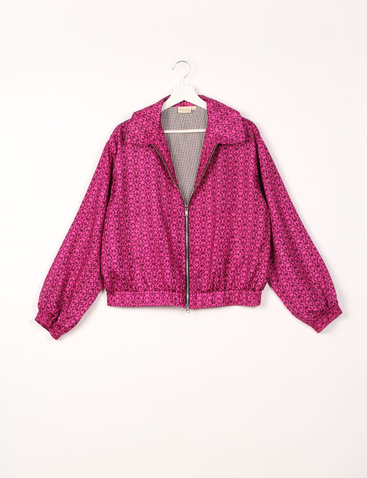 Stylish BOMBER JACKET, an upcycled clothing masterpiece with a cute cropped shape, elasticated details, and detachable metallic zipper. Contrast sari print lining adds a unique touch. Explore sustainable and eco-friendly fashion.