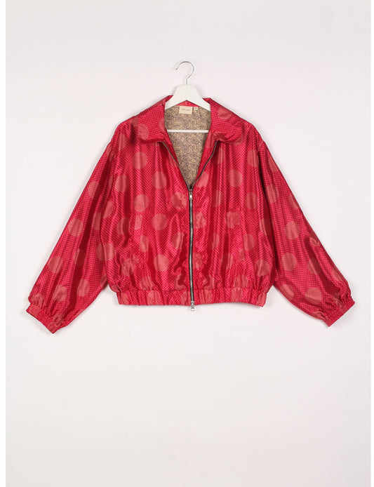 Stylish BOMBER JACKET, an upcycled clothing masterpiece with a cute cropped shape, elasticated details, and detachable metallic zipper. Contrast sari print lining adds a unique touch. Explore sustainable and eco-friendly fashion.