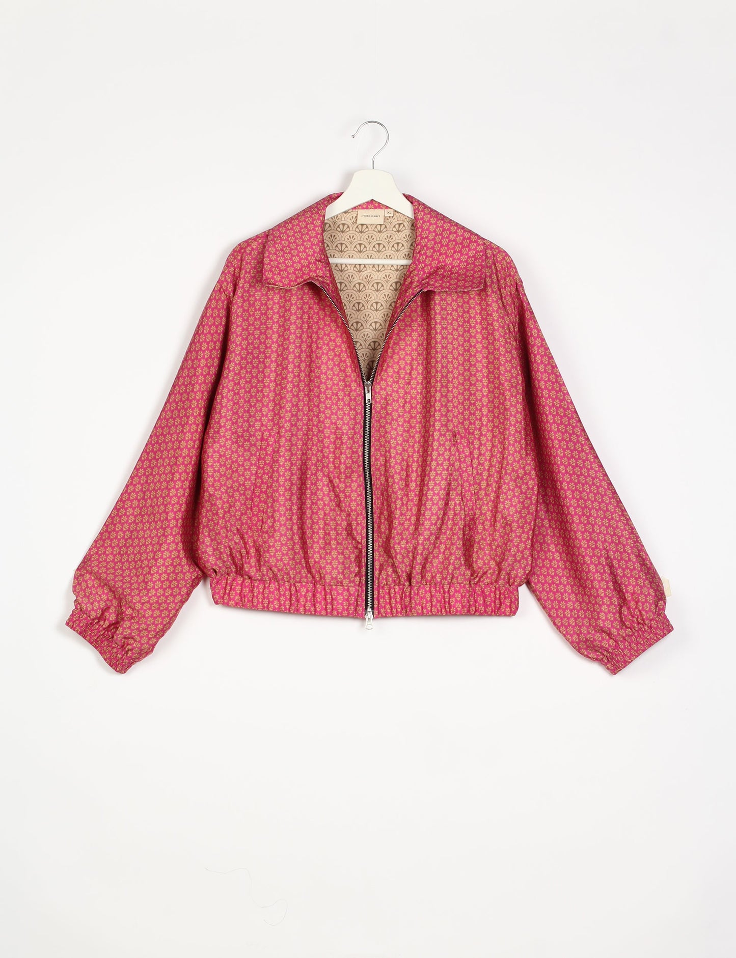 Stylish BOMBER JACKET, an upcycled clothing masterpiece with a cute cropped shape, elasticated details, and detachable metallic zipper. Contrast sari print lining adds a unique touch. Explore sustainable and eco-friendly fashion.