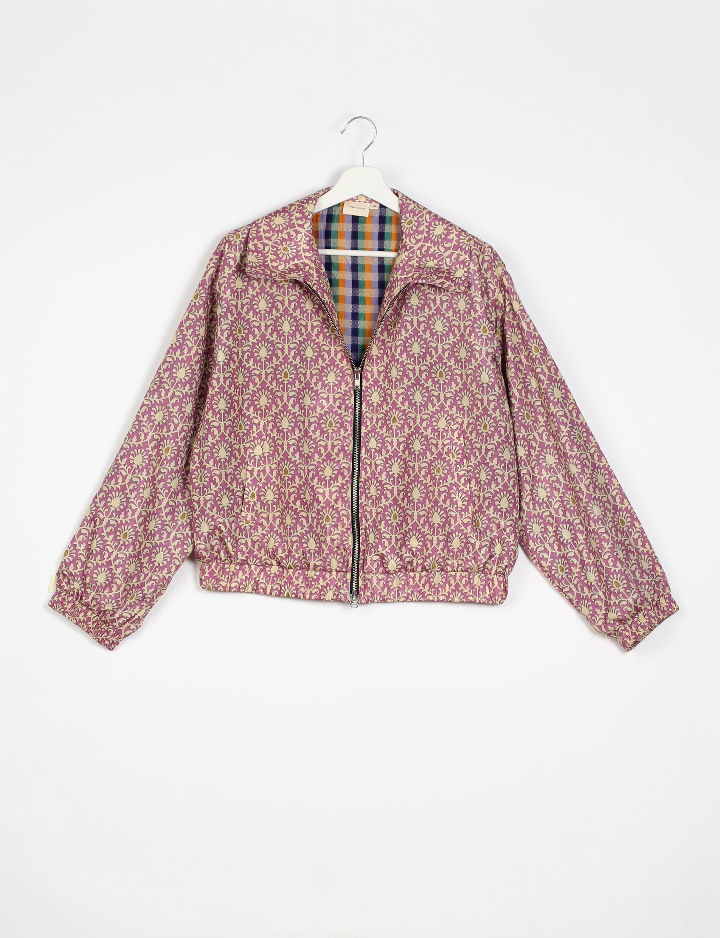 Stylish BOMBER JACKET, an upcycled clothing masterpiece with a cute cropped shape, elasticated details, and detachable metallic zipper. Contrast sari print lining adds a unique touch. Explore sustainable and eco-friendly fashion.