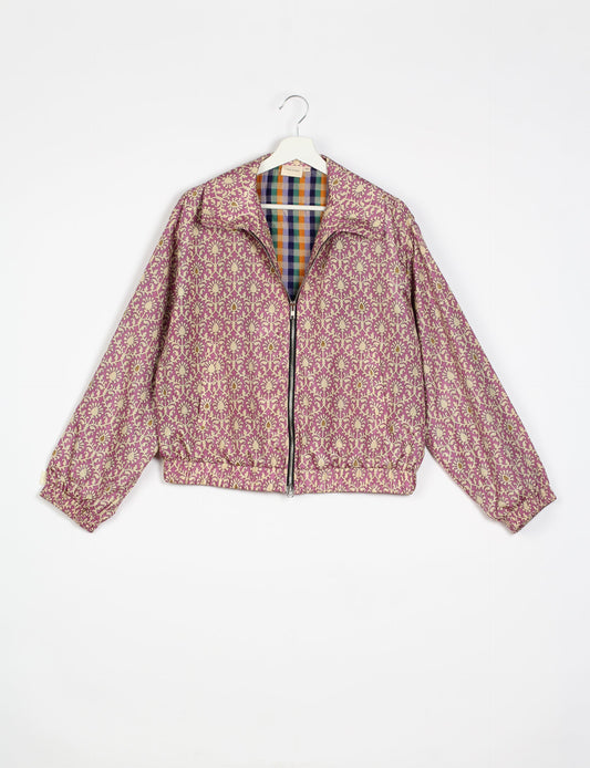 Stylish BOMBER JACKET, an upcycled clothing masterpiece with a cute cropped shape, elasticated details, and detachable metallic zipper. Contrast sari print lining adds a unique touch. Explore sustainable and eco-friendly fashion.