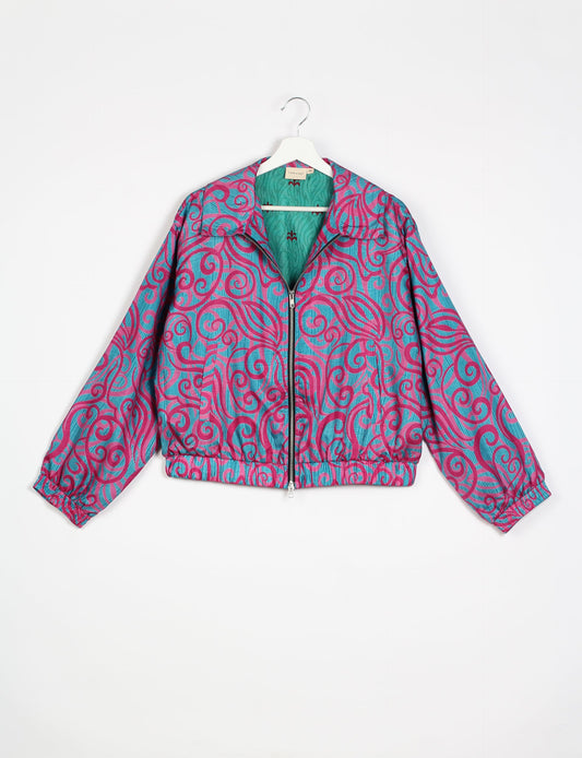 Stylish BOMBER JACKET, an upcycled clothing masterpiece with a cute cropped shape, elasticated details, and detachable metallic zipper. Contrast sari print lining adds a unique touch. Explore sustainable and eco-friendly fashion.