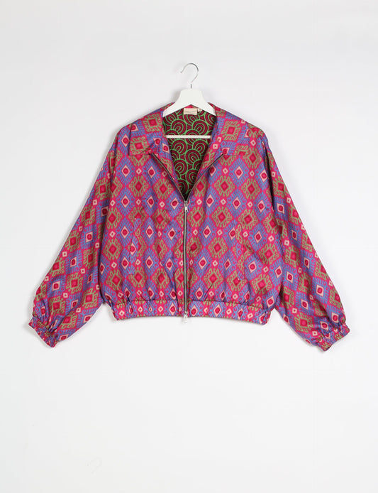 Stylish BOMBER JACKET, an upcycled clothing masterpiece with a cute cropped shape, elasticated details, and detachable metallic zipper. Contrast sari print lining adds a unique touch. Explore sustainable and eco-friendly fashion.