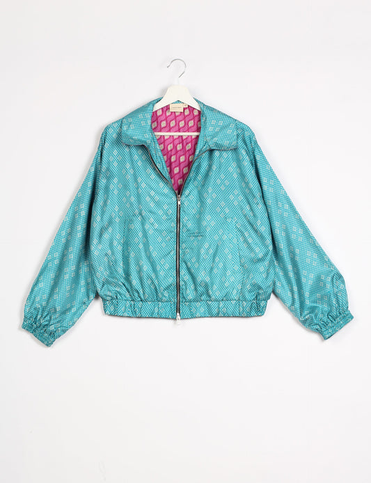 Stylish BOMBER JACKET, an upcycled clothing masterpiece with a cute cropped shape, elasticated details, and detachable metallic zipper. Contrast sari print lining adds a unique touch. Explore sustainable and eco-friendly fashion.