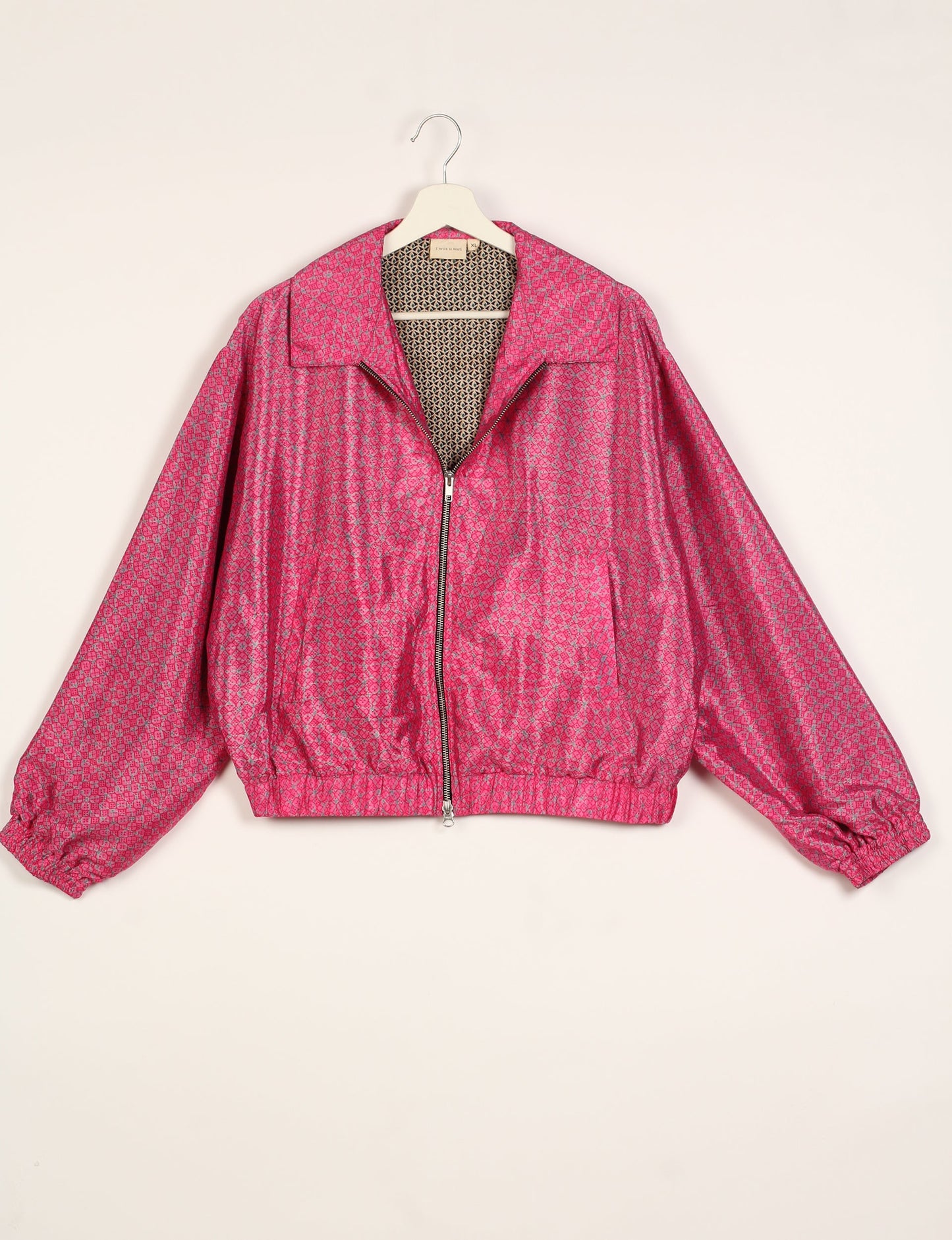 Stylish BOMBER JACKET, an upcycled clothing masterpiece with a cute cropped shape, elasticated details, and detachable metallic zipper. Contrast sari print lining adds a unique touch. Explore sustainable and eco-friendly fashion.