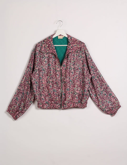 Stylish BOMBER JACKET, an upcycled clothing masterpiece with a cute cropped shape, elasticated details, and detachable metallic zipper. Contrast sari print lining adds a unique touch. Explore sustainable and eco-friendly fashion.