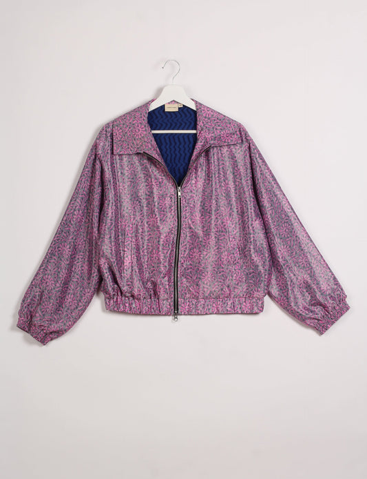 Stylish BOMBER JACKET, an upcycled clothing masterpiece with a cute cropped shape, elasticated details, and detachable metallic zipper. Contrast sari print lining adds a unique touch. Explore sustainable and eco-friendly fashion.