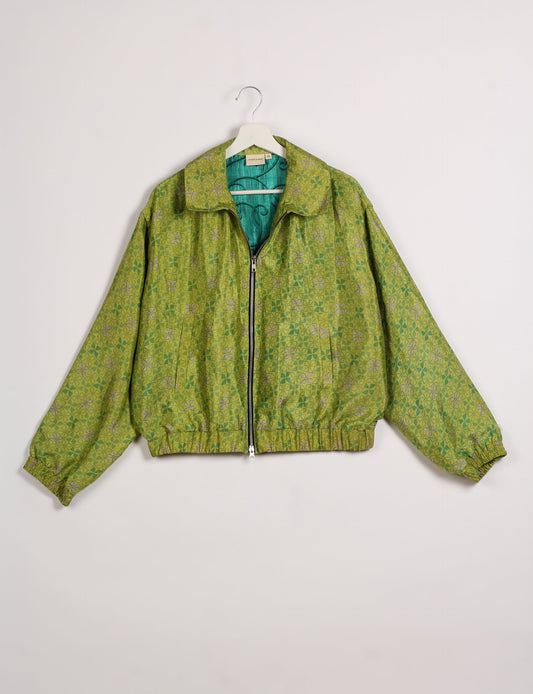 Stylish BOMBER JACKET, an upcycled clothing masterpiece with a cute cropped shape, elasticated details, and detachable metallic zipper. Contrast sari print lining adds a unique touch. Explore sustainable and eco-friendly fashion.