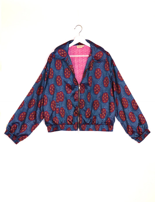 Stylish BOMBER JACKET, an upcycled clothing masterpiece with a cute cropped shape, elasticated details, and detachable metallic zipper. Contrast sari print lining adds a unique touch. Explore sustainable and eco-friendly fashion.