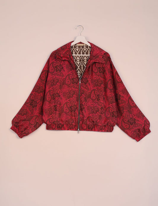 Stylish BOMBER JACKET, an upcycled clothing masterpiece with a cute cropped shape, elasticated details, and detachable metallic zipper. Contrast sari print lining adds a unique touch. Explore sustainable and eco-friendly fashion.