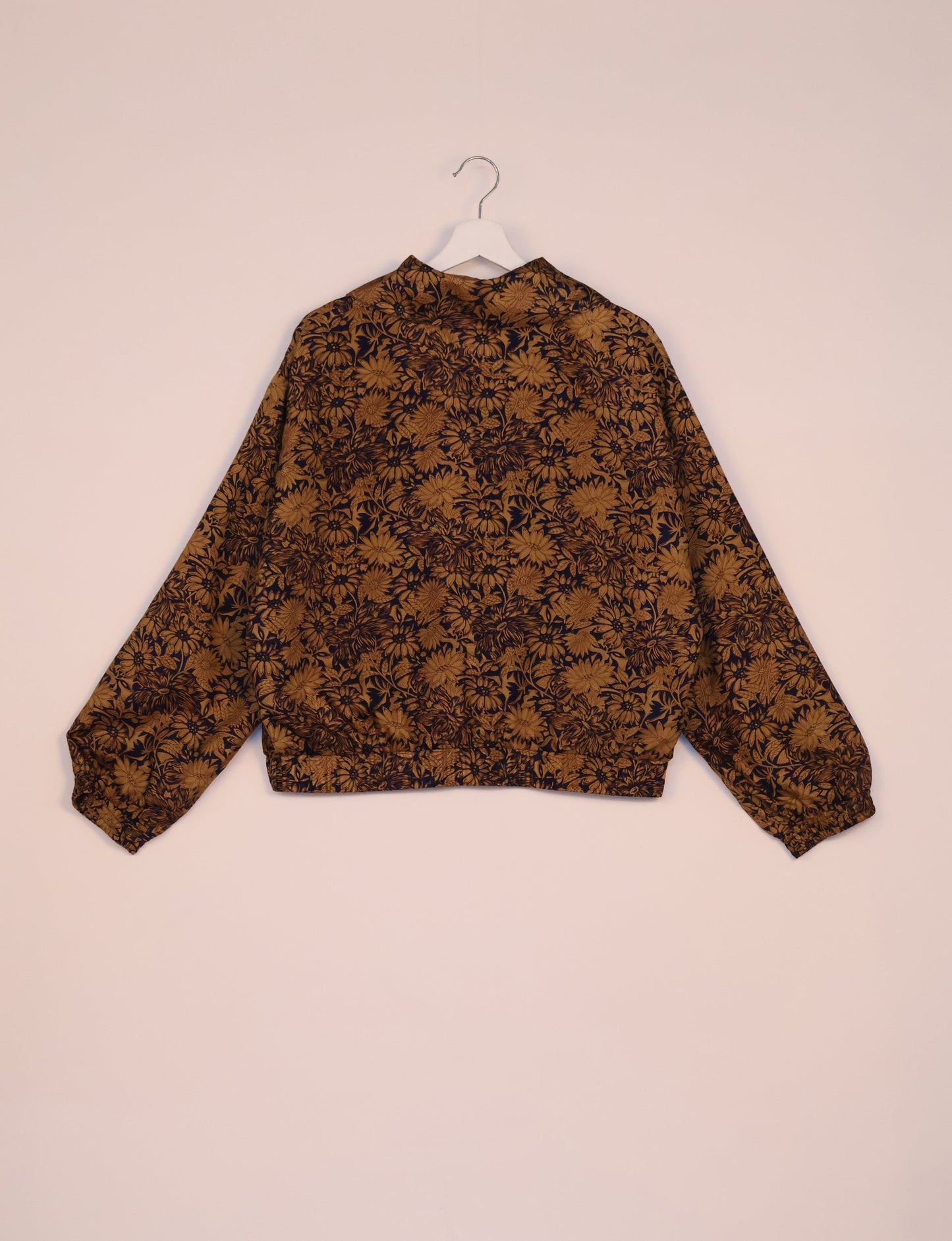 Stylish BOMBER JACKET, an upcycled clothing masterpiece with a cute cropped shape, elasticated details, and detachable metallic zipper. Contrast sari print lining adds a unique touch. Explore sustainable and eco-friendly fashion.