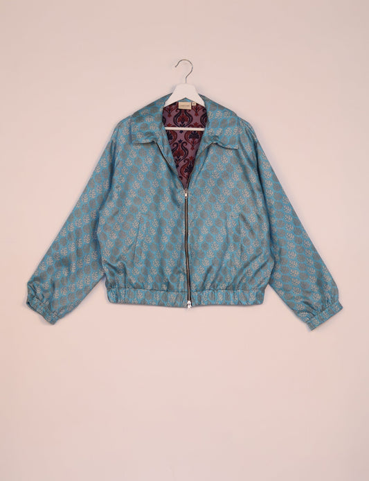 Stylish BOMBER JACKET, an upcycled clothing masterpiece with a cute cropped shape, elasticated details, and detachable metallic zipper. Contrast sari print lining adds a unique touch. Explore sustainable and eco-friendly fashion.