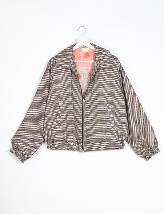 Stylish BOMBER JACKET, an upcycled clothing masterpiece with a cute cropped shape, elasticated details, and detachable metallic zipper. Contrast sari print lining adds a unique touch. Explore sustainable and eco-friendly fashion.