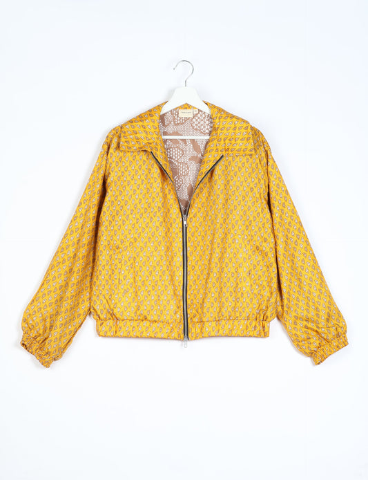 Stylish BOMBER JACKET, an upcycled clothing masterpiece with a cute cropped shape, elasticated details, and detachable metallic zipper. Contrast sari print lining adds a unique touch. Explore sustainable and eco-friendly fashion.