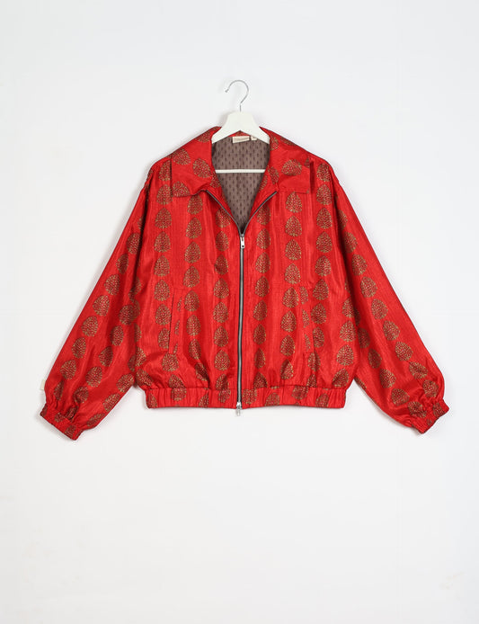 Stylish BOMBER JACKET, an upcycled clothing masterpiece with a cute cropped shape, elasticated details, and detachable metallic zipper. Contrast sari print lining adds a unique touch. Explore sustainable and eco-friendly fashion.