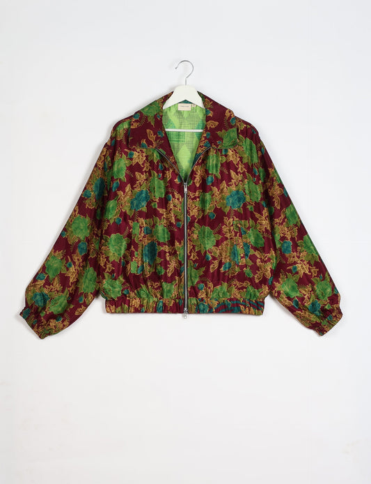 Stylish BOMBER JACKET, an upcycled clothing masterpiece with a cute cropped shape, elasticated details, and detachable metallic zipper. Contrast sari print lining adds a unique touch. Explore sustainable and eco-friendly fashion.