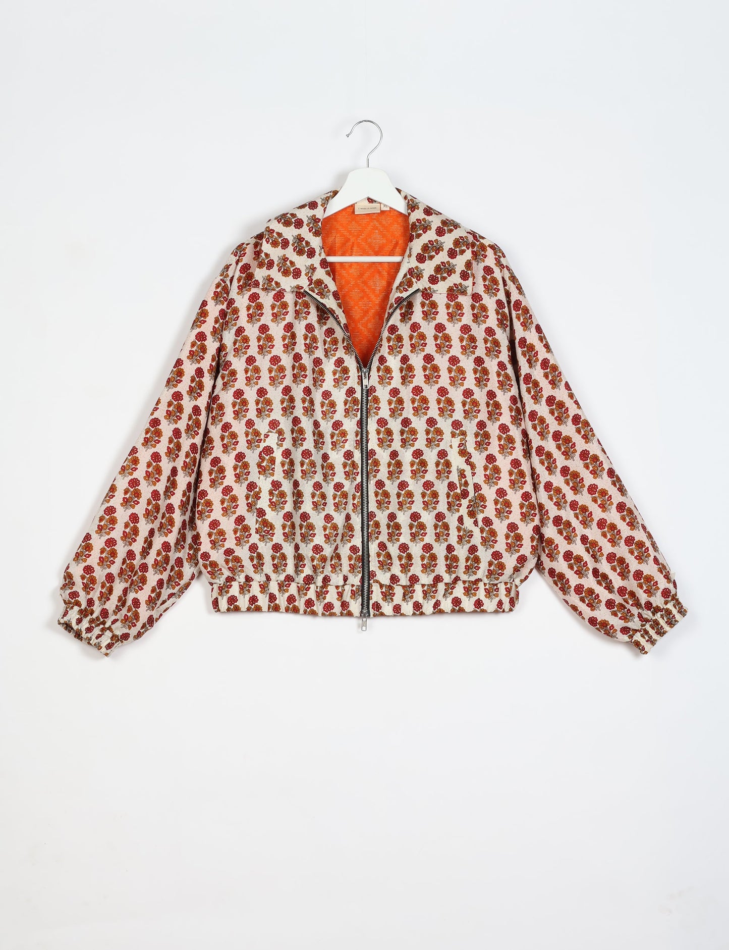 Stylish BOMBER JACKET, an upcycled clothing masterpiece with a cute cropped shape, elasticated details, and detachable metallic zipper. Contrast sari print lining adds a unique touch. Explore sustainable and eco-friendly fashion.