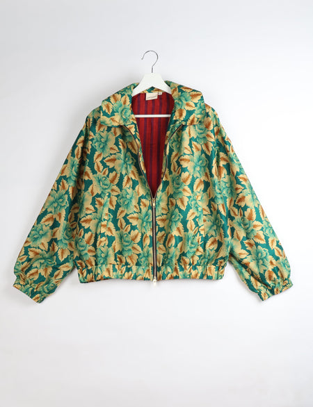 Upcycled Bomber Jacket made from recycled sari materials, featuring a cute cropped shape, elasticated hem and cuffs, and contrast sari print lining. Sustainable apparel promoting eco-friendly fashion and ethical clothing.