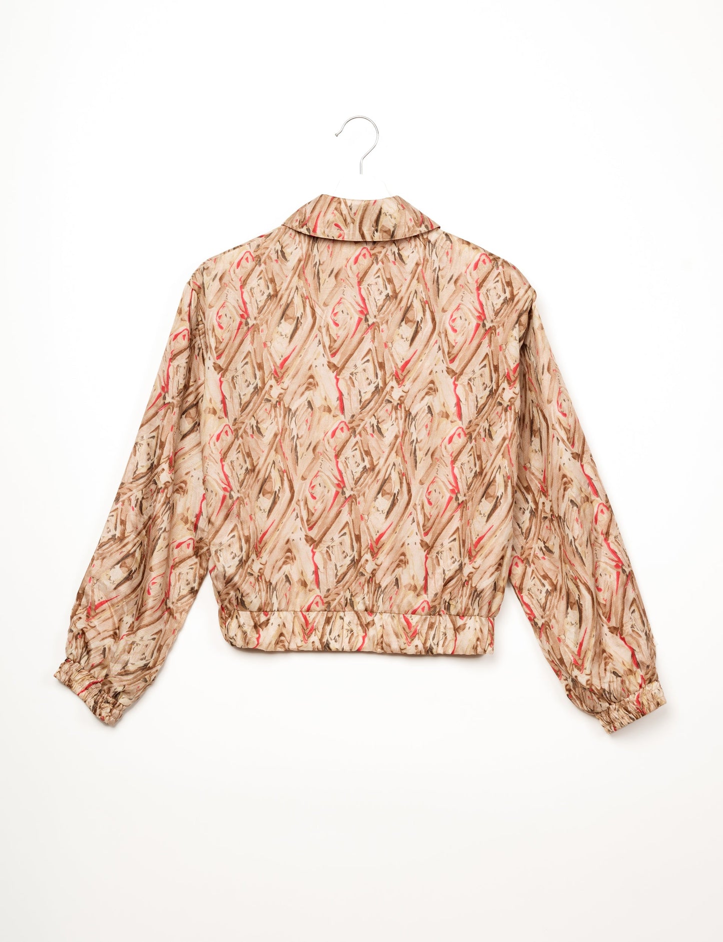 Stylish BOMBER JACKET, an upcycled clothing masterpiece with a cute cropped shape, elasticated details, and detachable metallic zipper. Contrast sari print lining adds a unique touch. Explore sustainable and eco-friendly fashion.