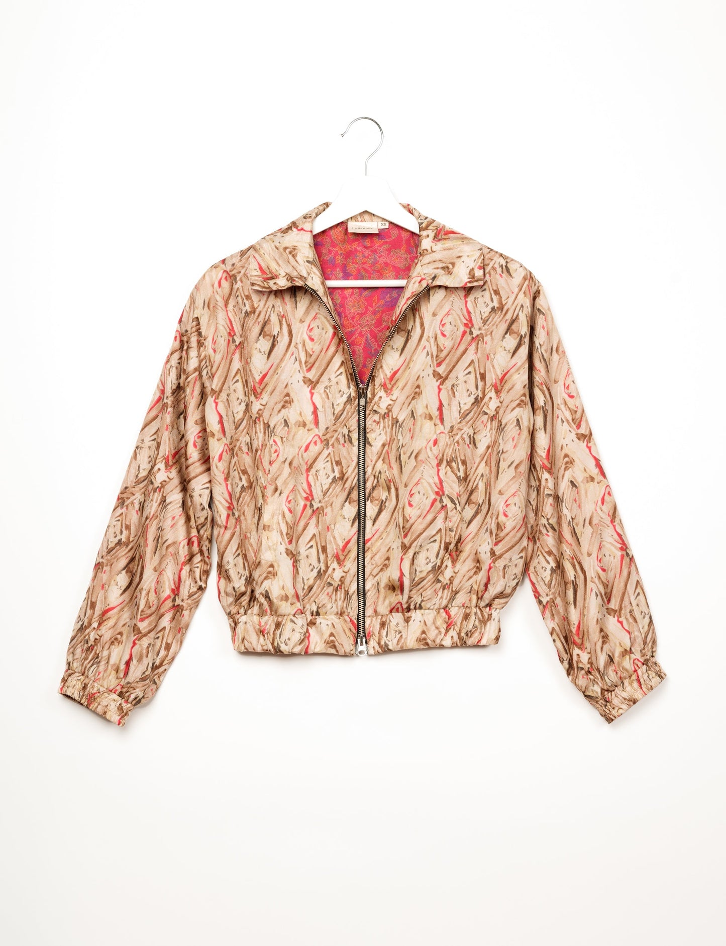 Stylish BOMBER JACKET, an upcycled clothing masterpiece with a cute cropped shape, elasticated details, and detachable metallic zipper. Contrast sari print lining adds a unique touch. Explore sustainable and eco-friendly fashion.