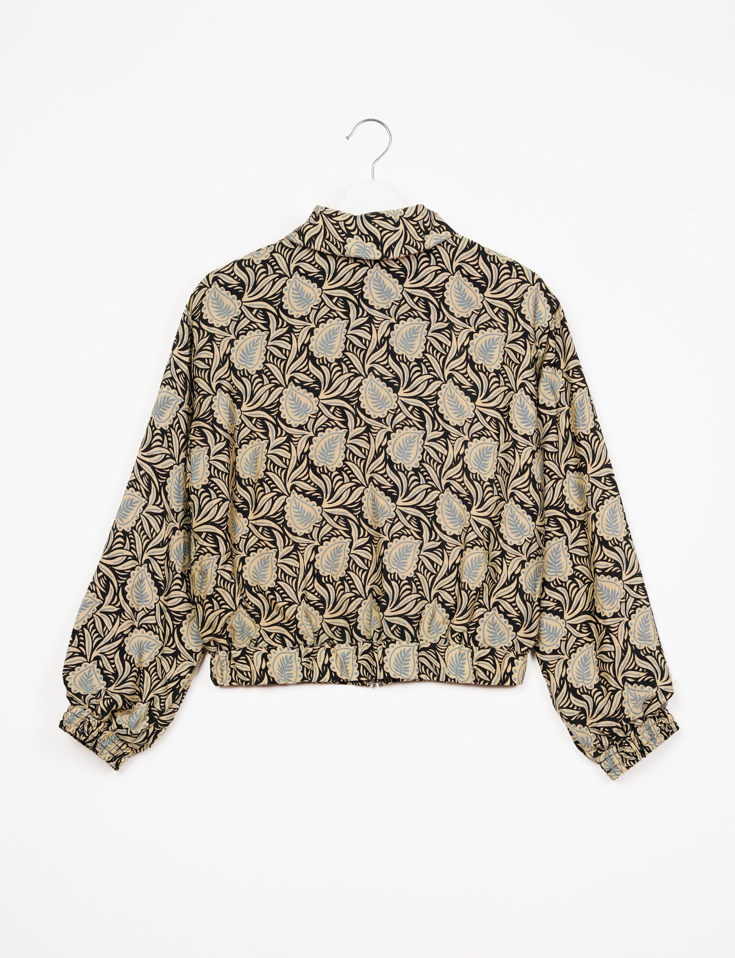 Stylish BOMBER JACKET, an upcycled clothing masterpiece with a cute cropped shape, elasticated details, and detachable metallic zipper. Contrast sari print lining adds a unique touch. Explore sustainable and eco-friendly fashion.