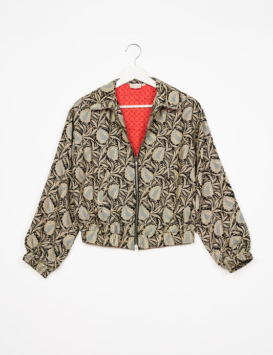 Stylish BOMBER JACKET, an upcycled clothing masterpiece with a cute cropped shape, elasticated details, and detachable metallic zipper. Contrast sari print lining adds a unique touch. Explore sustainable and eco-friendly fashion.