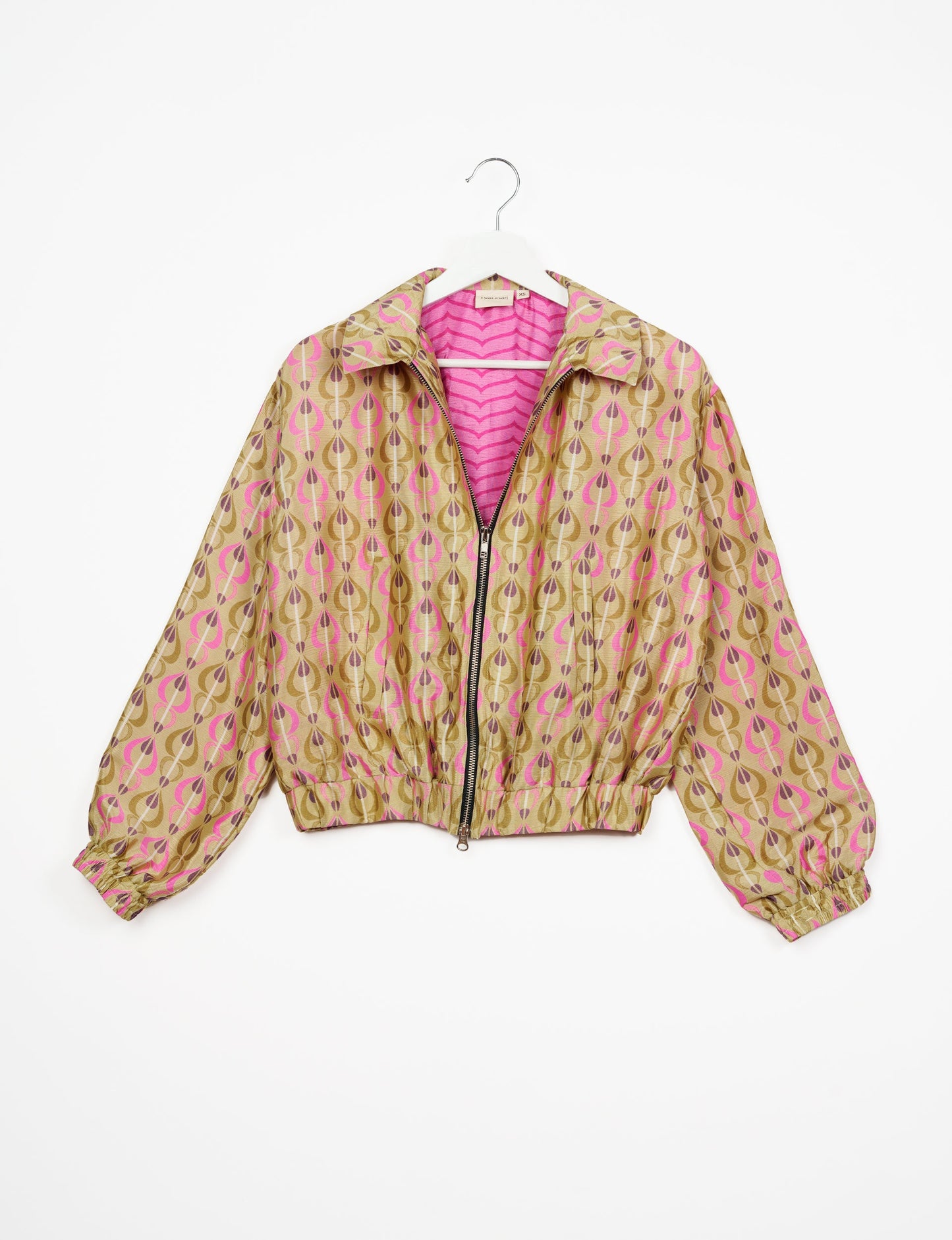 Stylish BOMBER JACKET, an upcycled clothing masterpiece with a cute cropped shape, elasticated details, and detachable metallic zipper. Contrast sari print lining adds a unique touch. Explore sustainable and eco-friendly fashion.