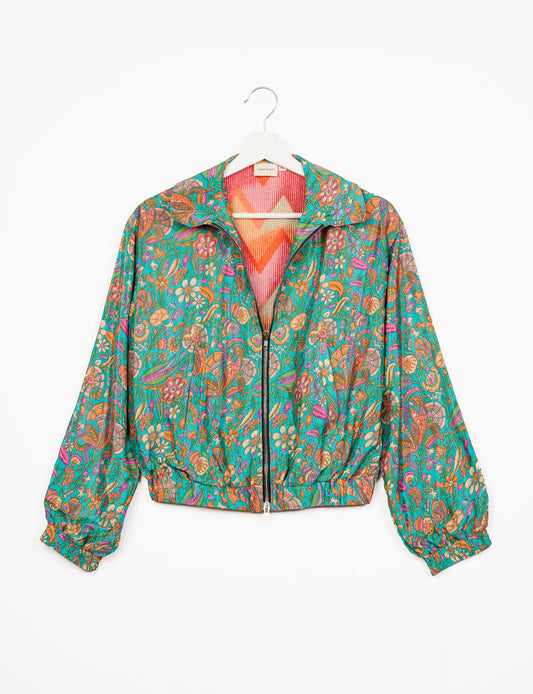 Stylish BOMBER JACKET, an upcycled clothing masterpiece with a cute cropped shape, elasticated details, and detachable metallic zipper. Contrast sari print lining adds a unique touch. Explore sustainable and eco-friendly fashion.