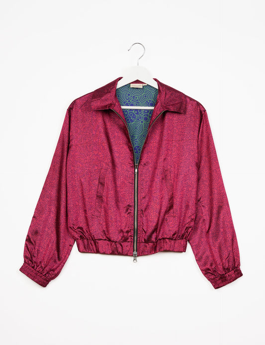 Stylish BOMBER JACKET, an upcycled clothing masterpiece with a cute cropped shape, elasticated details, and detachable metallic zipper. Contrast sari print lining adds a unique touch. Explore sustainable and eco-friendly fashion.