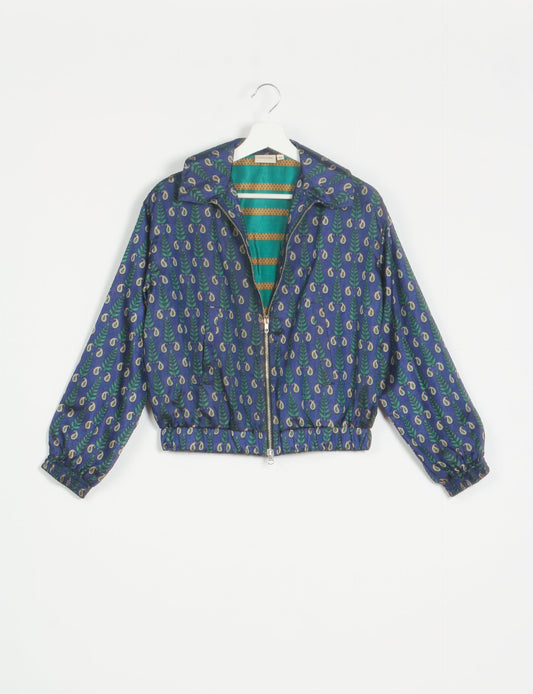 Stylish BOMBER JACKET, an upcycled clothing masterpiece with a cute cropped shape, elasticated details, and detachable metallic zipper. Contrast sari print lining adds a unique touch. Explore sustainable and eco-friendly fashion.