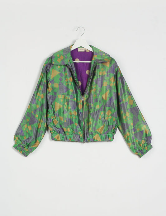 Stylish BOMBER JACKET, an upcycled clothing masterpiece with a cute cropped shape, elasticated details, and detachable metallic zipper. Contrast sari print lining adds a unique touch. Explore sustainable and eco-friendly fashion.