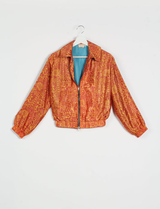 Stylish BOMBER JACKET, an upcycled clothing masterpiece with a cute cropped shape, elasticated details, and detachable metallic zipper. Contrast sari print lining adds a unique touch. Explore sustainable and eco-friendly fashion.