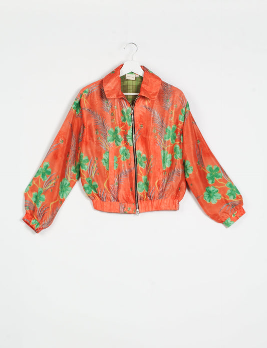 Stylish BOMBER JACKET, an upcycled clothing masterpiece with a cute cropped shape, elasticated details, and detachable metallic zipper. Contrast sari print lining adds a unique touch. Explore sustainable and eco-friendly fashion.