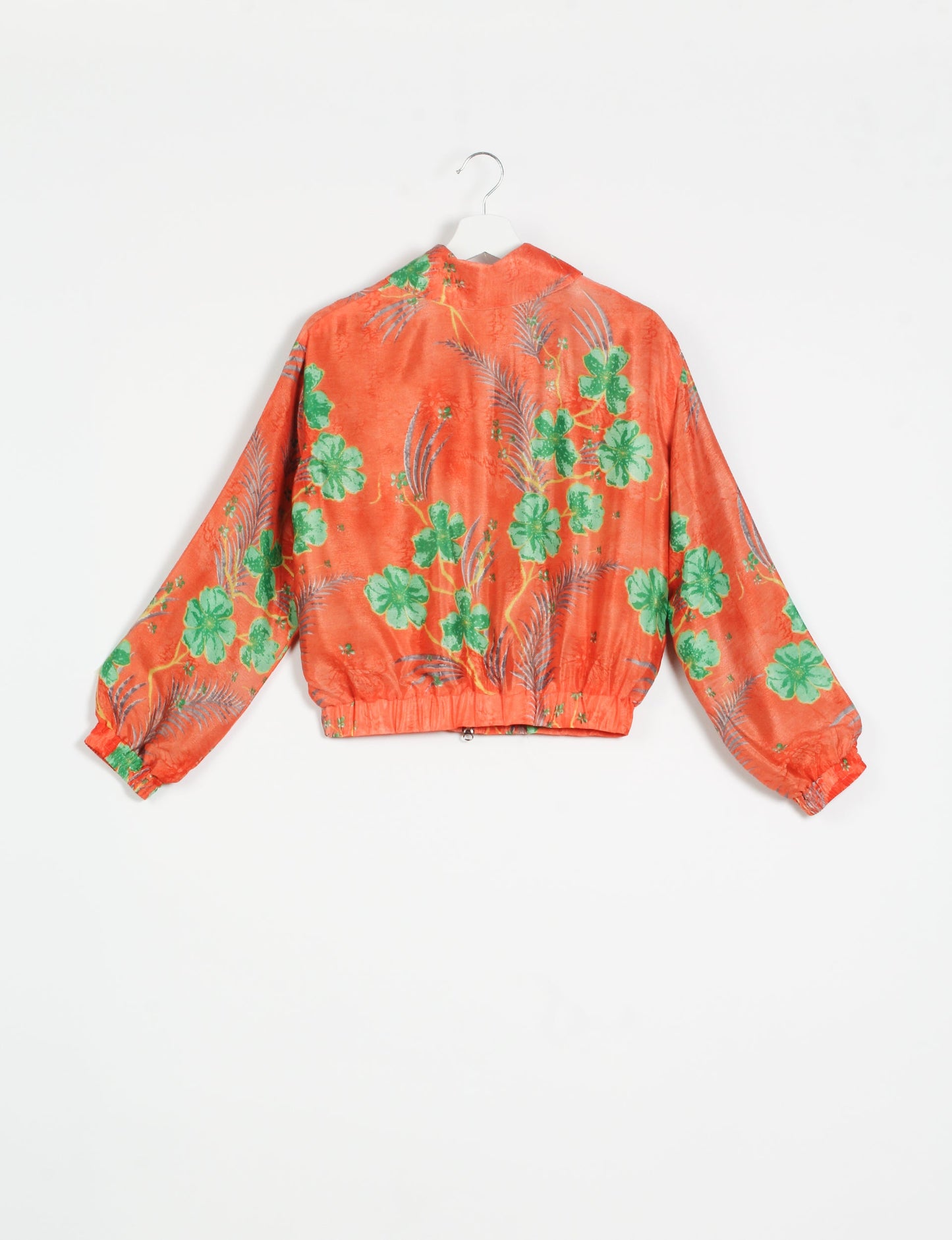 Stylish BOMBER JACKET, an upcycled clothing masterpiece with a cute cropped shape, elasticated details, and detachable metallic zipper. Contrast sari print lining adds a unique touch. Explore sustainable and eco-friendly fashion.