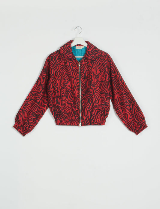 Stylish BOMBER JACKET, an upcycled clothing masterpiece with a cute cropped shape, elasticated details, and detachable metallic zipper. Contrast sari print lining adds a unique touch. Explore sustainable and eco-friendly fashion.