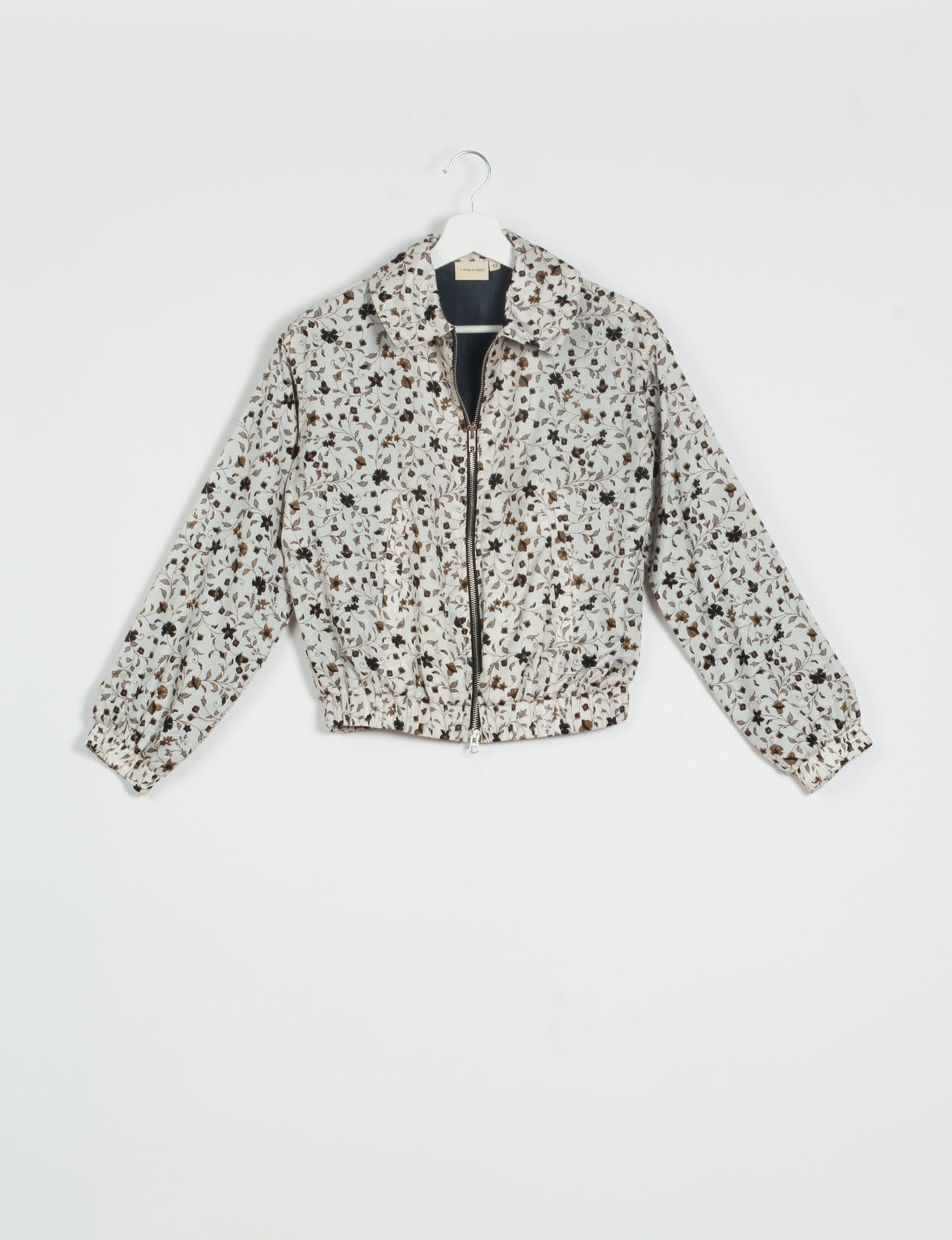 Stylish BOMBER JACKET, an upcycled clothing masterpiece with a cute cropped shape, elasticated details, and detachable metallic zipper. Contrast sari print lining adds a unique touch. Explore sustainable and eco-friendly fashion.