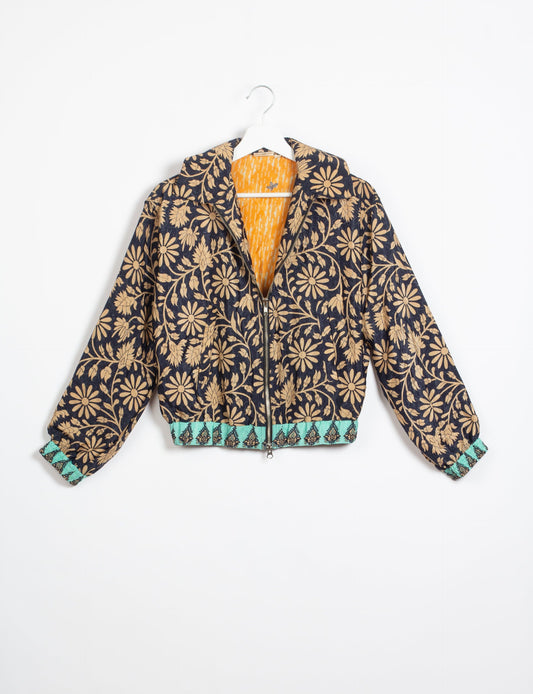 Stylish BOMBER JACKET, an upcycled clothing masterpiece with a cute cropped shape, elasticated details, and detachable metallic zipper. Contrast sari print lining adds a unique touch. Explore sustainable and eco-friendly fashion.