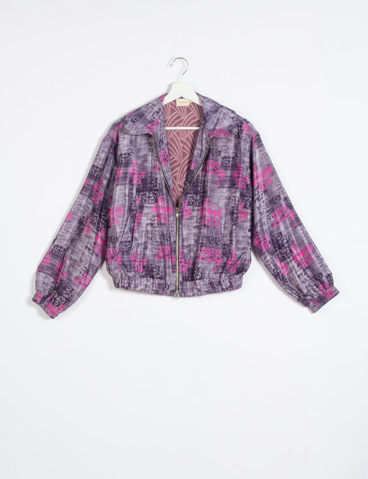 Stylish BOMBER JACKET, an upcycled clothing masterpiece with a cute cropped shape, elasticated details, and detachable metallic zipper. Contrast sari print lining adds a unique touch. Explore sustainable and eco-friendly fashion.