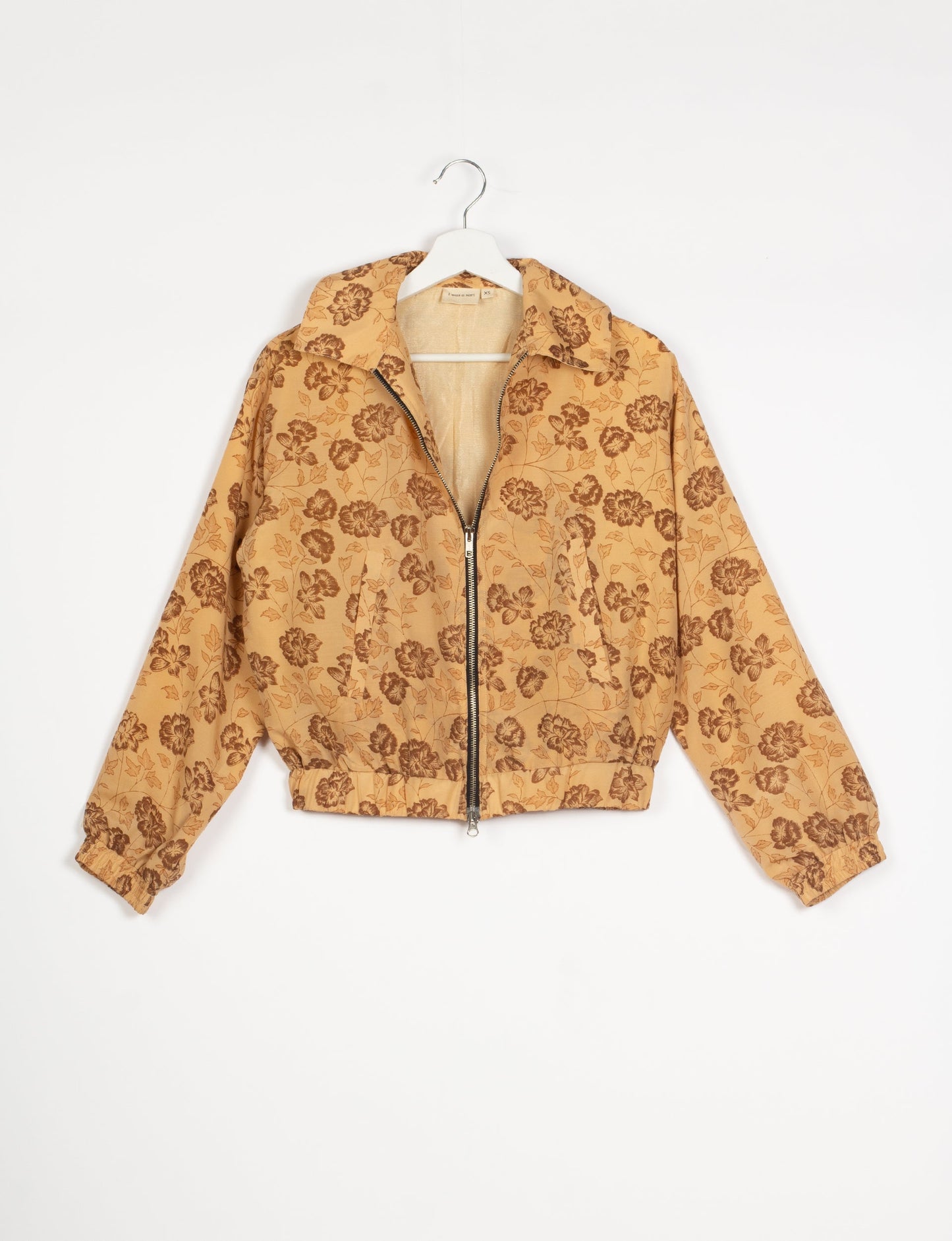 Stylish BOMBER JACKET, an upcycled clothing masterpiece with a cute cropped shape, elasticated details, and detachable metallic zipper. Contrast sari print lining adds a unique touch. Explore sustainable and eco-friendly fashion.