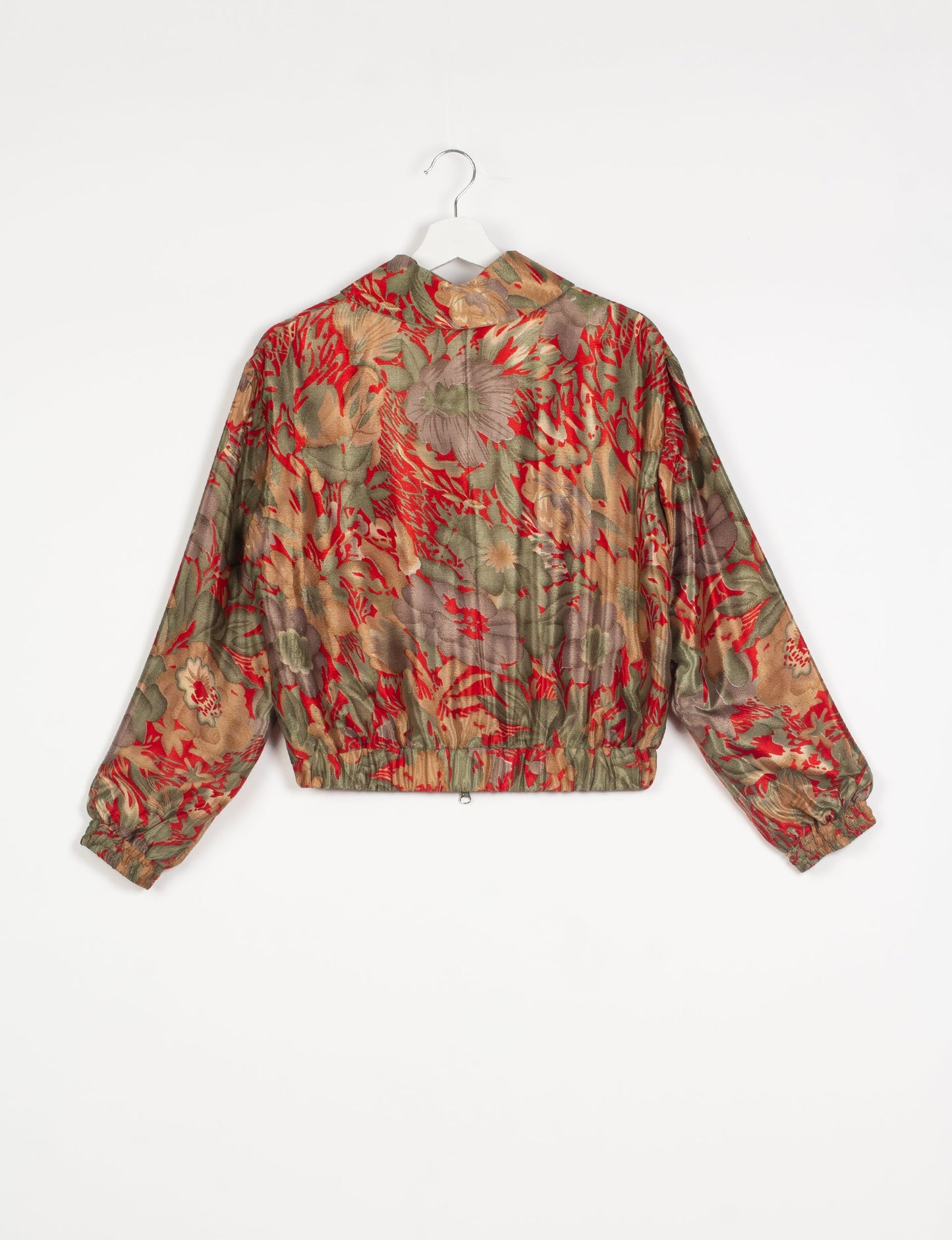 Stylish BOMBER JACKET, an upcycled clothing masterpiece with a cute cropped shape, elasticated details, and detachable metallic zipper. Contrast sari print lining adds a unique touch. Explore sustainable and eco-friendly fashion.