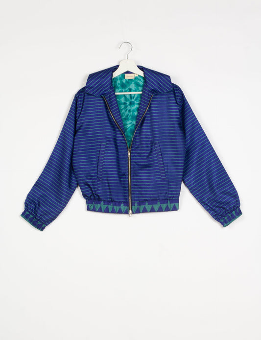 Stylish BOMBER JACKET, an upcycled clothing masterpiece with a cute cropped shape, elasticated details, and detachable metallic zipper. Contrast sari print lining adds a unique touch. Explore sustainable and eco-friendly fashion.