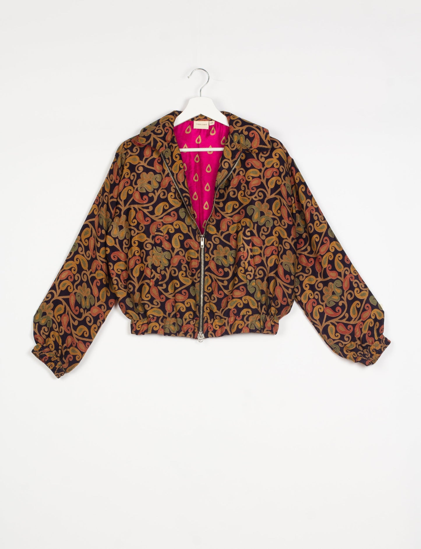 Stylish BOMBER JACKET, an upcycled clothing masterpiece with a cute cropped shape, elasticated details, and detachable metallic zipper. Contrast sari print lining adds a unique touch. Explore sustainable and eco-friendly fashion.