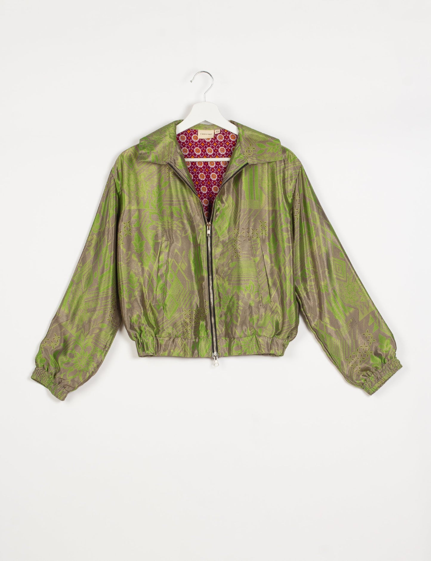 Stylish BOMBER JACKET, an upcycled clothing masterpiece with a cute cropped shape, elasticated details, and detachable metallic zipper. Contrast sari print lining adds a unique touch. Explore sustainable and eco-friendly fashion.