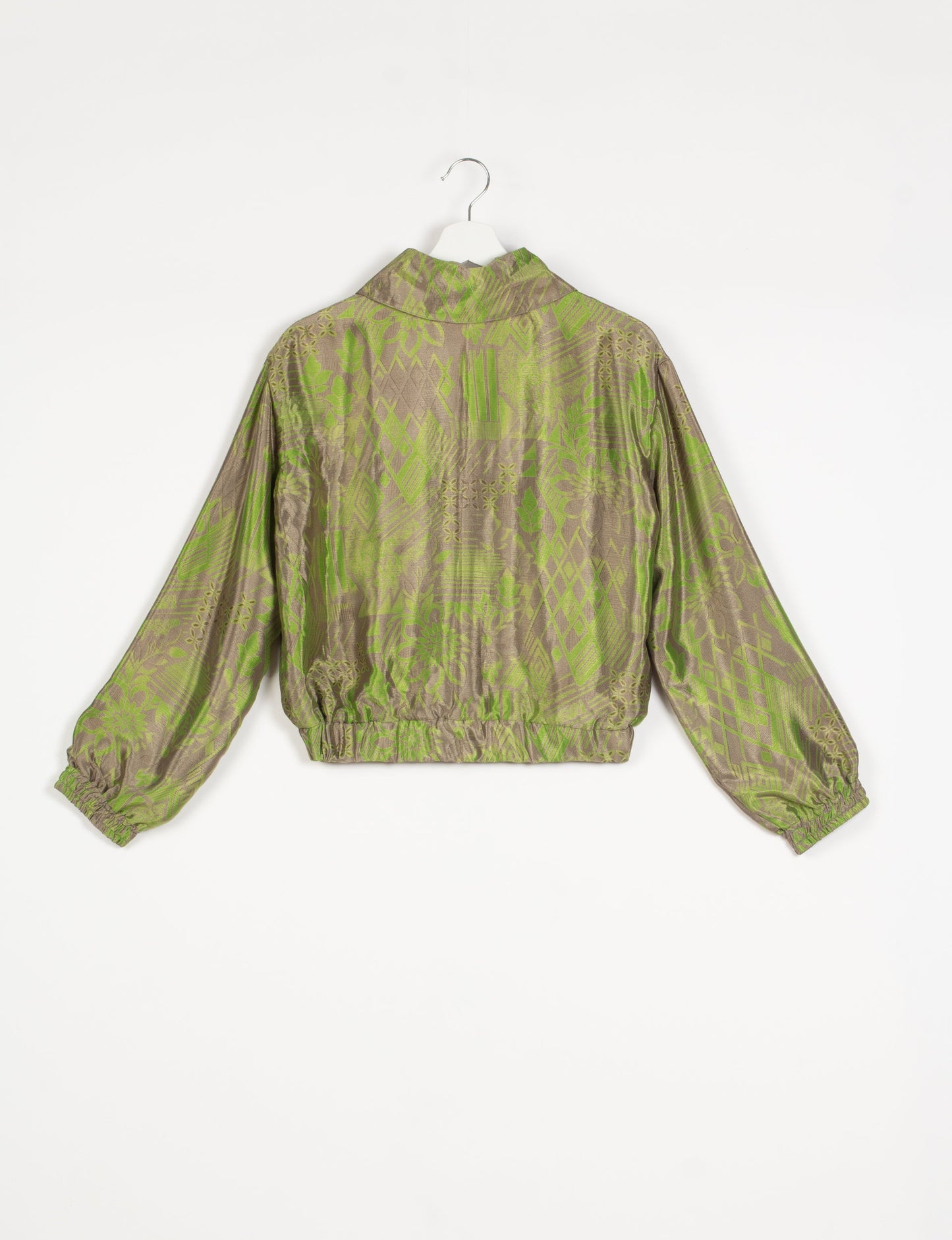 Stylish BOMBER JACKET, an upcycled clothing masterpiece with a cute cropped shape, elasticated details, and detachable metallic zipper. Contrast sari print lining adds a unique touch. Explore sustainable and eco-friendly fashion.