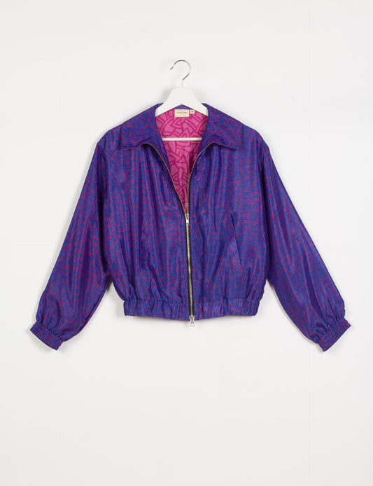 Stylish BOMBER JACKET, an upcycled clothing masterpiece with a cute cropped shape, elasticated details, and detachable metallic zipper. Contrast sari print lining adds a unique touch. Explore sustainable and eco-friendly fashion.