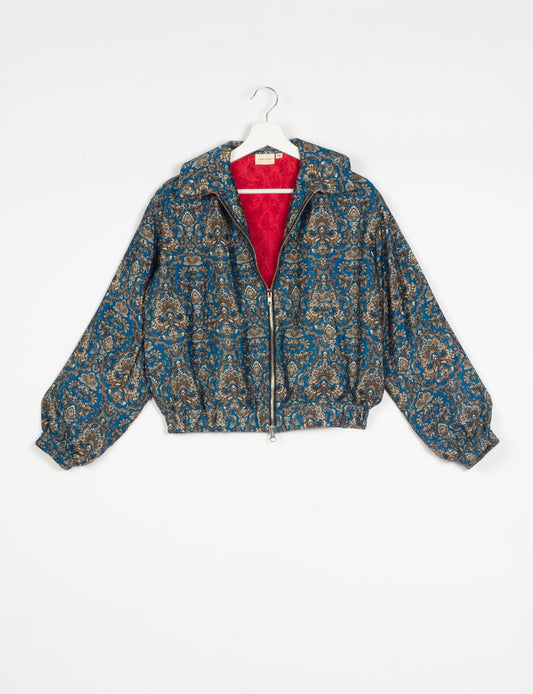 Stylish BOMBER JACKET, an upcycled clothing masterpiece with a cute cropped shape, elasticated details, and detachable metallic zipper. Contrast sari print lining adds a unique touch. Explore sustainable and eco-friendly fashion.