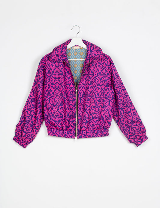 Stylish BOMBER JACKET, an upcycled clothing masterpiece with a cute cropped shape, elasticated details, and detachable metallic zipper. Contrast sari print lining adds a unique touch. Explore sustainable and eco-friendly fashion.