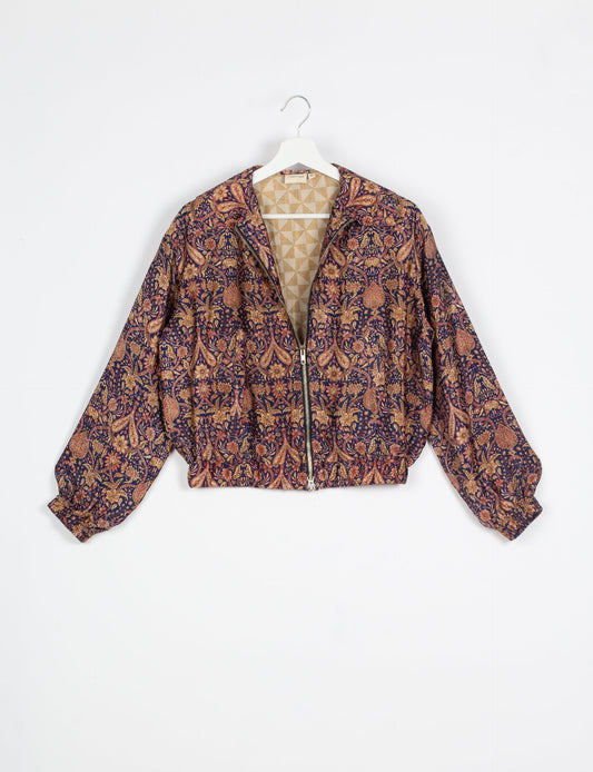 Stylish BOMBER JACKET, an upcycled clothing masterpiece with a cute cropped shape, elasticated details, and detachable metallic zipper. Contrast sari print lining adds a unique touch. Explore sustainable and eco-friendly fashion.